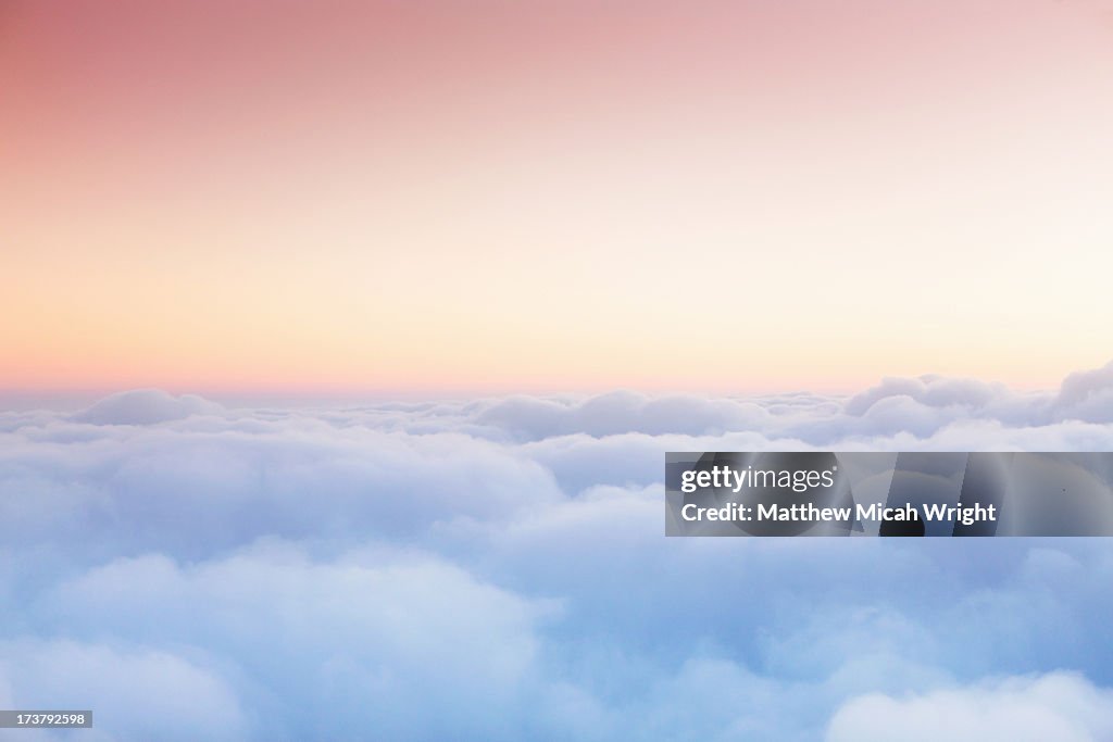 Soft clouds blanket the sky during flight
