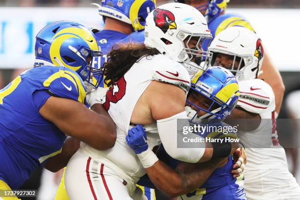 Corey Clement of the Arizona Cardinals is tackled by Cory Durden of the Los Angeles Rams during the fourth quarter at SoFi Stadium on October 15,...