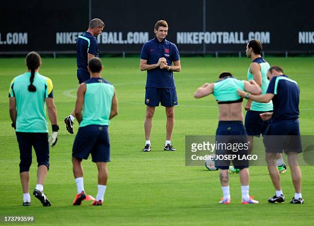 Barcelona's coach Tito Vilanova takes part in the training session at the FC Barcelona Sports Center Joan Gamper in Sant Joan Despi, near Barcelona,...