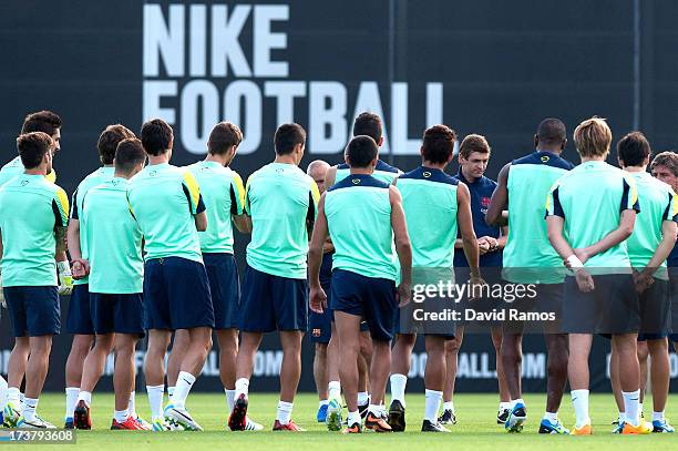 Head coach Tito Vilanova speaks to his players during a training session at the Sant Joan Despi sport complex on July 18, 2013 in Barcelona, Spain.