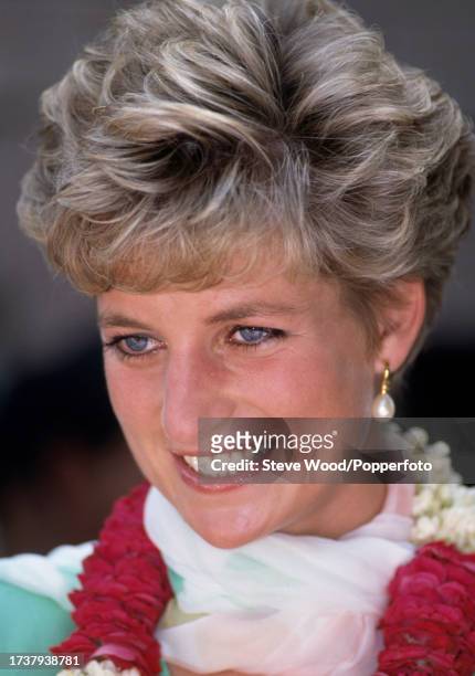 Princess Diana wearing a flower garland while visiting the Sheesh Mahal in Lahore during an official solo tour of Pakistan on 25th September, 1991....
