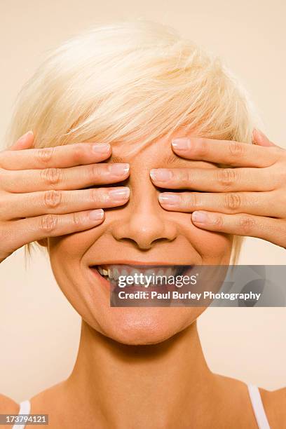 Woman Covering Her Eyes High-Res Stock Photo
