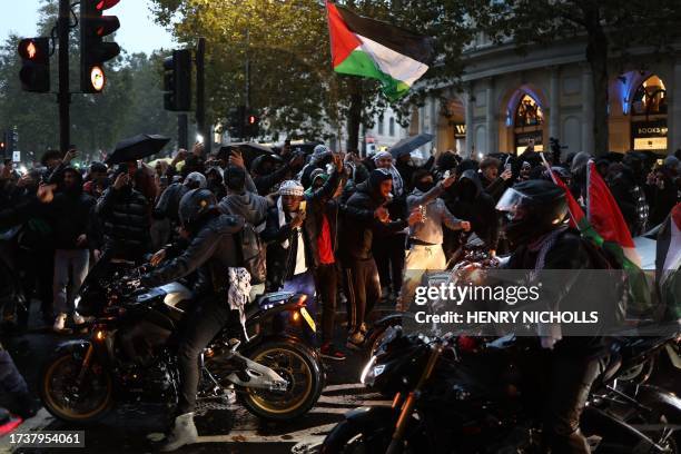 People on motorcycles arrive at Trafalgar Square at the end of a 'March For Palestine', in London on October 21 to "demand an end to the war on...