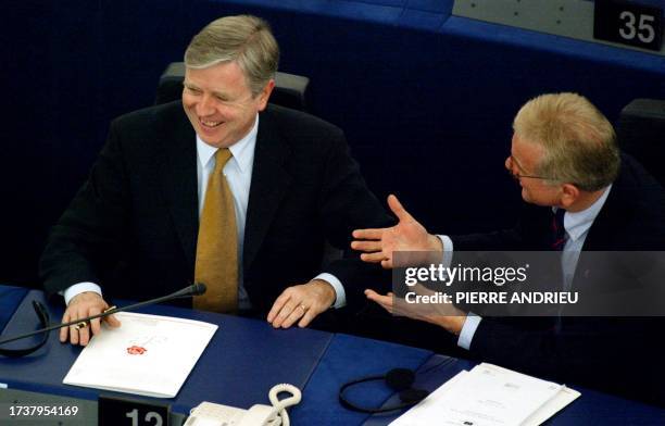 Liberal Democrat euro deputy from Ireland, Patrick Cox smiles as he listens to German euro deputy Hans Get Pottering, 14 January 2002 at the start of...