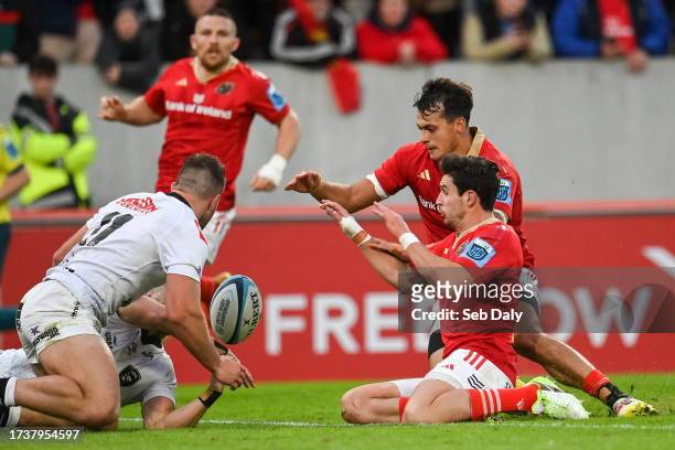 Limerick , Ireland - 21 October 2023; Antoine Frisch of Munster, behind, supported by teammate Joey Carbery, before touching down to score his side's...