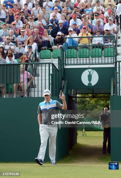 Justin Rose of England walks onto the 1st tee during the first round of the 142nd Open Championship at Muirfield on July 18, 2013 in Gullane,...