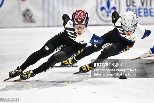 Park Ji Won of the Republic of Korea and Seo Yi Ra of the Republic of Korea compete in the men's 1000 m quarterfinals during the ISU World Cup Short...