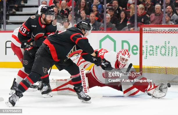 Ville Husso of the Detroit Red Wings makes a save against Parker Kelly of the Ottawa Senators at Canadian Tire Centre on October 21, 2023 in Ottawa,...