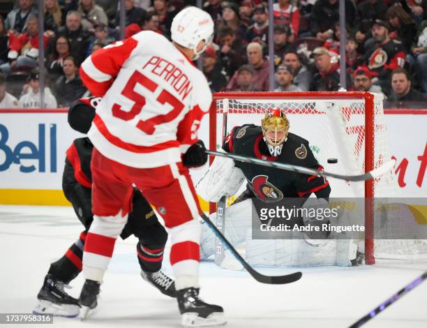David Perron of the Detroit Red Wings scores a second period goal against Joonas Korpisalo of the Ottawa Senators at Canadian Tire Centre on October...