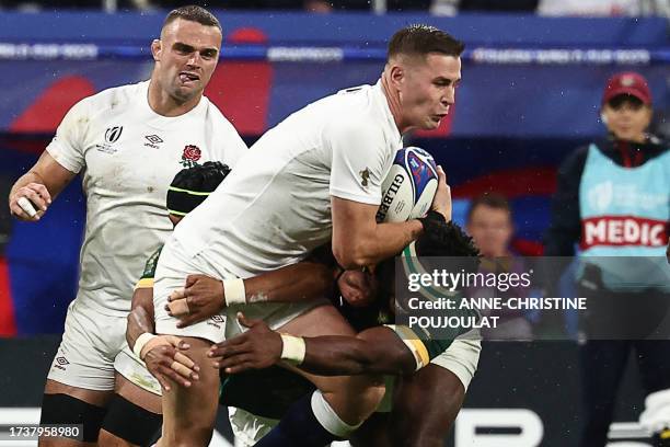 England's full-back Freddie Steward is tackled by South Africa's blindside flanker and captain Siya Kolisi and South Africa's right wing Kurt-Lee...
