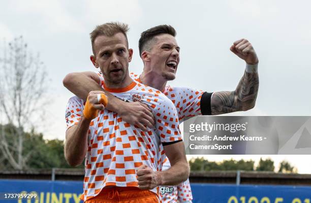 Blackpool's Jordan Rhodes celebrates scoring his side's first goal with team mate Oliver Casey during the Sky Bet League One match between Oxford...