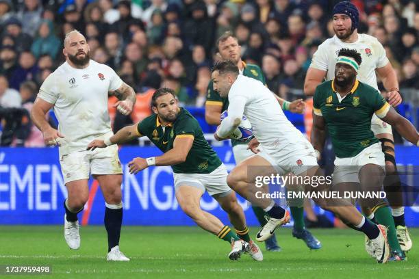 England's right wing Jonny May runs with the ball as he is chased by South Africa's scrum-half Cobus Reinach and South Africa's blindside flanker and...