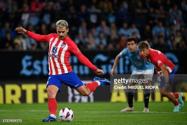 Atletico Madrid's French forward Antoine Griezmann takes a penalty kick and scores his team's first goal during the Spanish league football match...