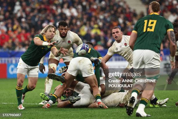 South Africa's scrum-half Faf de Klerk passes the ball out from a South Africa ruck during the France 2023 Rugby World Cup semi-final match between...