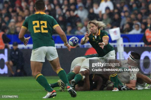 South Africa's scrum-half Faf de Klerk passes the ball to South Africa's fly-half Handre Pollard during the France 2023 Rugby World Cup semi-final...