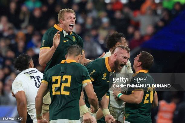 South Africa's lock RG Snyman celebrates with teammates after scoring a try during the France 2023 Rugby World Cup semi-final match between England...
