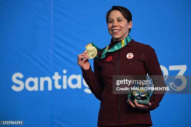 Canada's Rachel Nicol celebrates after winning the gold medal in the women's 100m breaststroke final A swimming event of the Pan American Games...