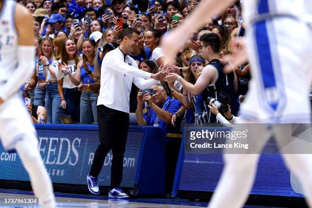 Head coach Jon Scheyer of the Duke Blue Devils joins the Cameron Crazies during Countdown to Craziness at Cameron Indoor Stadium on October 20, 2023...