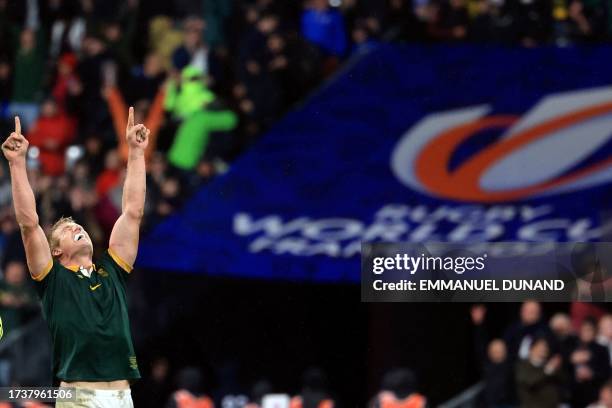 South Africa's openside flanker Pieter-Steph du Toit celebrates after South Africa won the France 2023 Rugby World Cup semi-final match between...