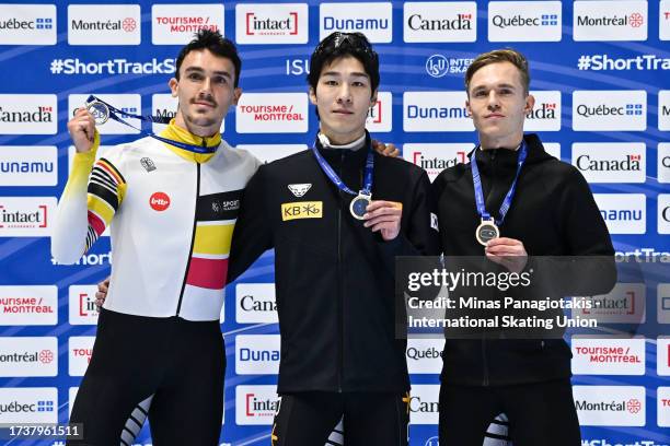 Stijn Desmet of Belgium, Hwang Daeheon of the Republic of Korea and Reinis Berzins of Latvia pose with their medals after competing in the men's 1500...