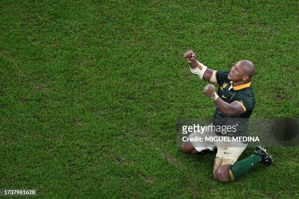 South Africa's hooker Bongi Mbonambi raises his arms as he celebrates South Africa's victory at the end of the France 2023 Rugby World Cup semi-final...
