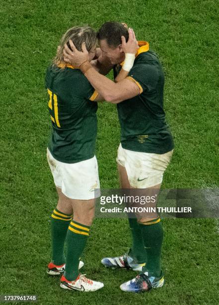 South Africa's scrum-half Faf de Klerk and South Africa's hooker Deon Fourie celebrate after victory in the France 2023 Rugby World Cup semi-final...