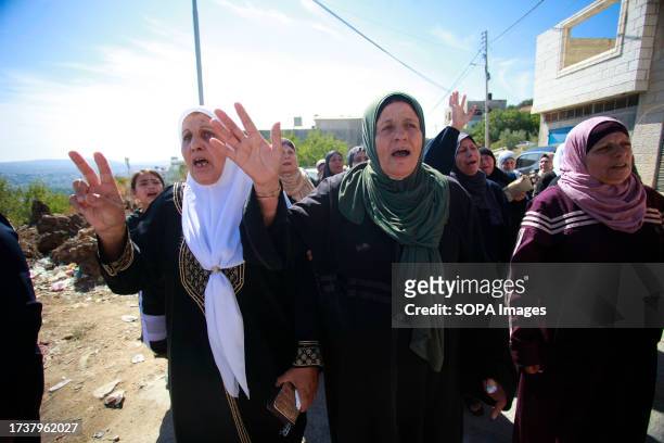 Women mourn during the funeral in the occupied West Bank village of Kafr Qallil of 17-year-old Oday Mansour, a day after he was killed during the...