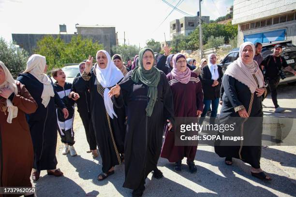Women mourn during the funeral in the occupied West Bank village of Kafr Qallil of 17-year-old Oday Mansour, a day after he was killed during the...