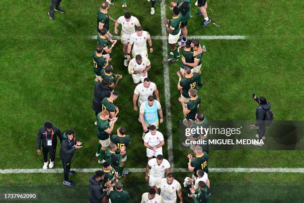 South Africa's team players applaud as England's team players leave the pitch after their defeat in the France 2023 Rugby World Cup semi-final match...