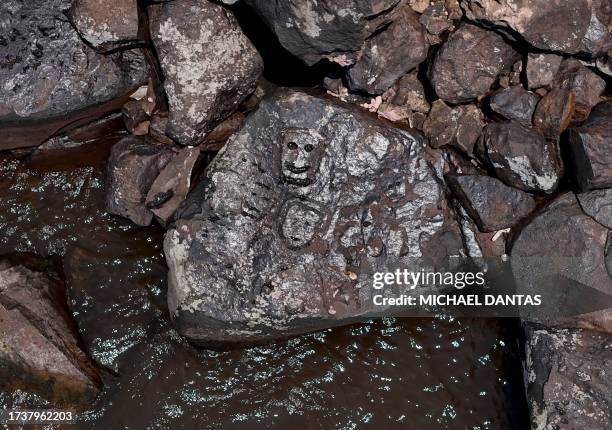 Ancient rock carvings that reappeared in the region of the Lajes Archaeological Site due to the severe drought affecting the region's rivers are...