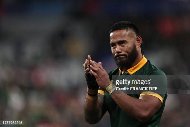 England's centre Manu Tuilagi, wearing a South African jersey, applauds after South Africa won the France 2023 Rugby World Cup semi-final match...