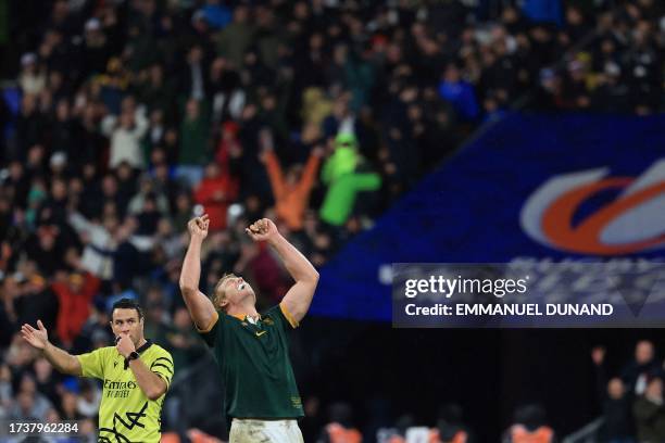 South Africa's openside flanker Pieter-Steph du Toit celebrates as New Zealand referee Ben O'Keeffe blows the final whistle as South Africa wins the...