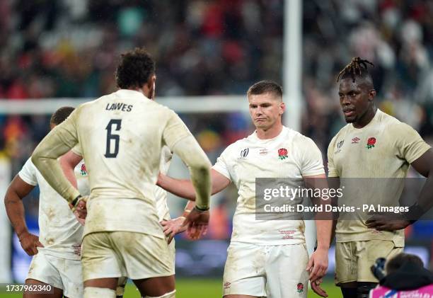 England's Courtney Lawes, Owen Farrell and Maro Itoje dejected following the Rugby World Cup 2023 semi final match at the Stade de France,...