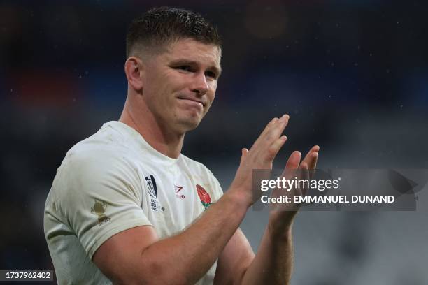 England's fly-half and captain Owen Farrell gestures after South Africa won the France 2023 Rugby World Cup semi-final match between England and...