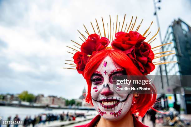 People dressed up as Catrina or Catrin, the female and male skeletons to celebrate in advanced the celebration of Day of Dead or Dias de los Muertos,...