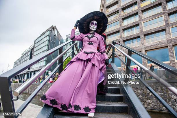 People dressed up as Catrina or Catrin, the female and male skeletons to celebrate in advanced the celebration of Day of Dead or Dias de los Muertos,...