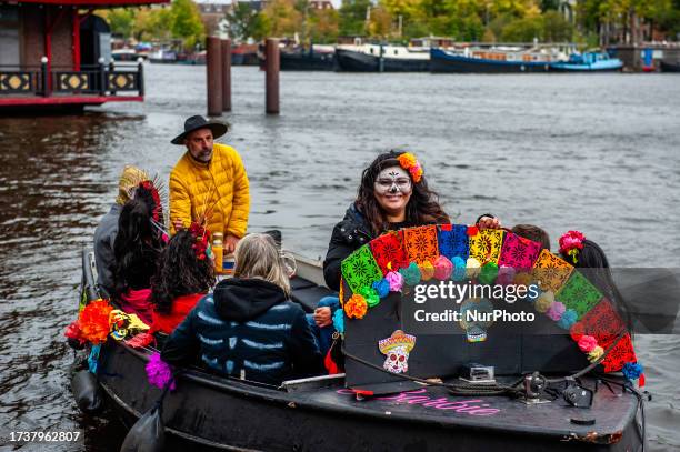 People dressed up as Catrina or Catrin, the female and male skeletons to celebrate in advanced the celebration of Day of Dead or Dias de los Muertos,...