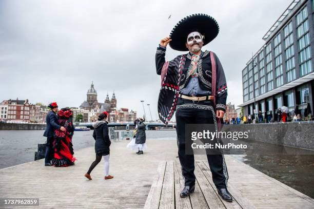 People dressed up as Catrina or Catrin, the female and male skeletons to celebrate in advanced the celebration of Day of Dead or Dias de los Muertos,...