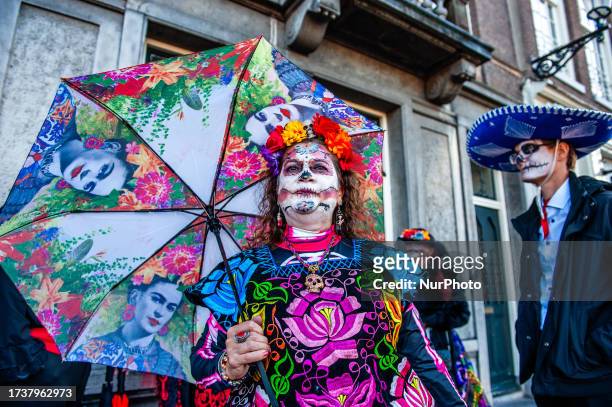 People dressed up as Catrina or Catrin, the female and male skeletons to celebrate in advanced the celebration of Day of Dead or Dias de los Muertos,...