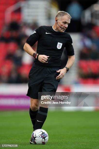 Referee Graham Scott looks on during the Sky Bet Championship match between Stoke City and Sunderland at Bet365 Stadium on October 21, 2023 in Stoke...