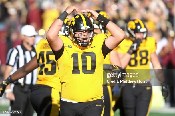 Quarterback Deacon Hill of the Iowa Hawkeyes celebrates a touchdown during the first half against the Minnesota Golden Gophers at Kinnick Stadium on...