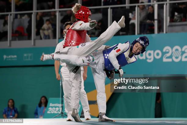 Andrea Ramirez of Colombia fights against Daniela Souza of Mexico in Women's Kyorougi - 48kg finals at Parque Deportivo Estadio Nacional on day 1 of...