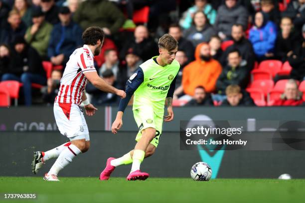 Jack Clarke of Sunderland runs with the ball under pressure from Ben Pearson of Stoke City during the Sky Bet Championship match between Stoke City...