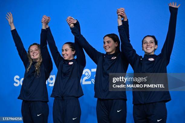 Women swimming team Amy Fulmer, Catherine De Loof, Kayla Wilson and Gabriela Albiero, celebrate after winning the silver medal during the women's...