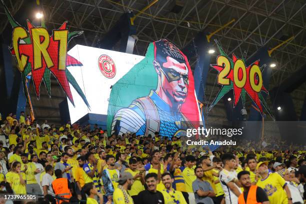 Fans of Al-Nassr show their support during the Saudi Pro League week 10 soccer match between Al-Nassr and Damac at Al-Awwal Park, in Riyadh, Saudi...