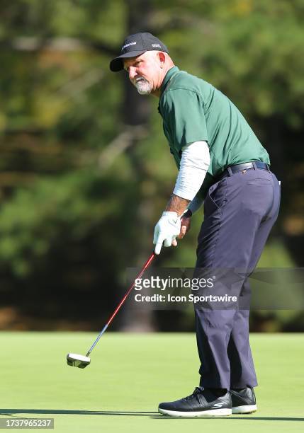 Marco Dawson watches his putt on the 17th green during the second round of the Dominion Energy Charity Classic on October 21 at The Country Club of...