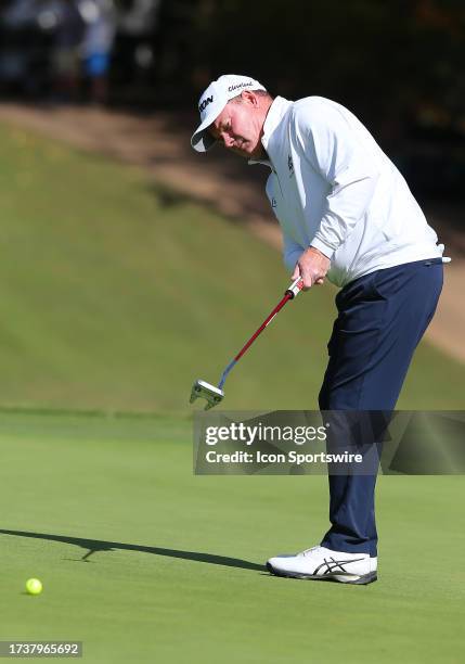 Joe Durant watches his putt on the 17th green during the second round of the Dominion Energy Charity Classic on October 21 at The Country Club of...