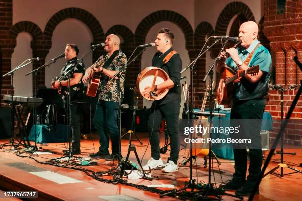 Darren Holden, Finbarr Clancy, Brian Dunphy and Paul O'Brien of the Irish folk group The High Kings perform live on stage during a concert at the...