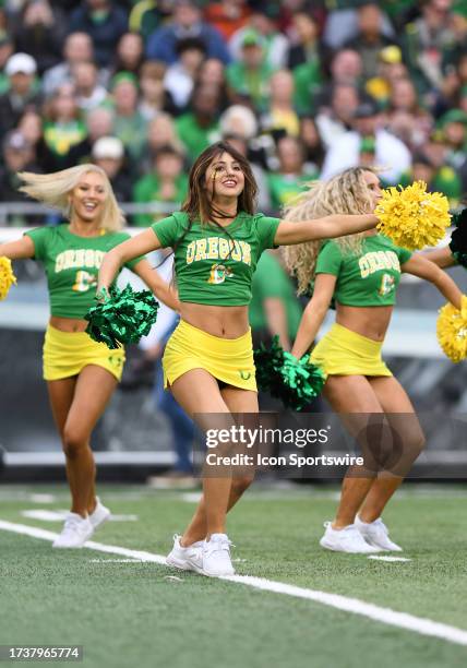 Oregon Ducks cheerleaders perform for the crowd during a college football game between the Oregon Ducks and Washington State Cougars on October 21 at...