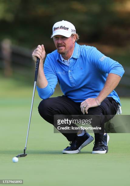 Tim Petrovic surveys the slope of the 17th green during the second round of the Dominion Energy Charity Classic on October 21 at The Country Club of...